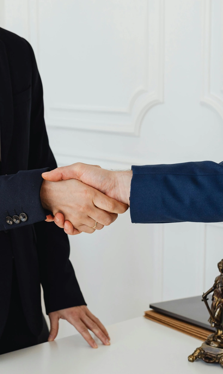 lawyer shaking hands with clients